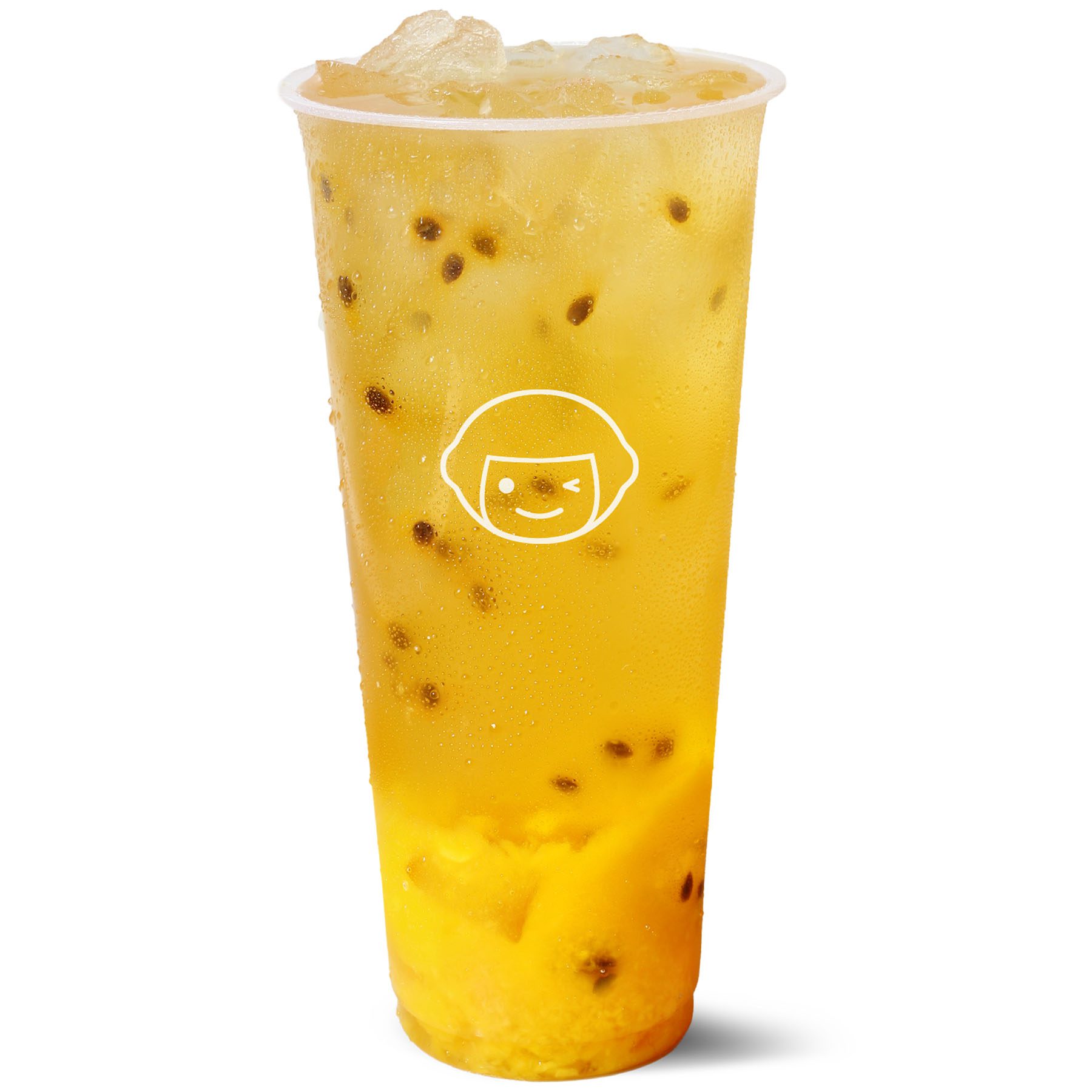 A clear plastic cup filled with iced yellow passion fruit tea, containing visible passion fruit seeds and chunks of fruit, with a white logo of a winking face on the cup.