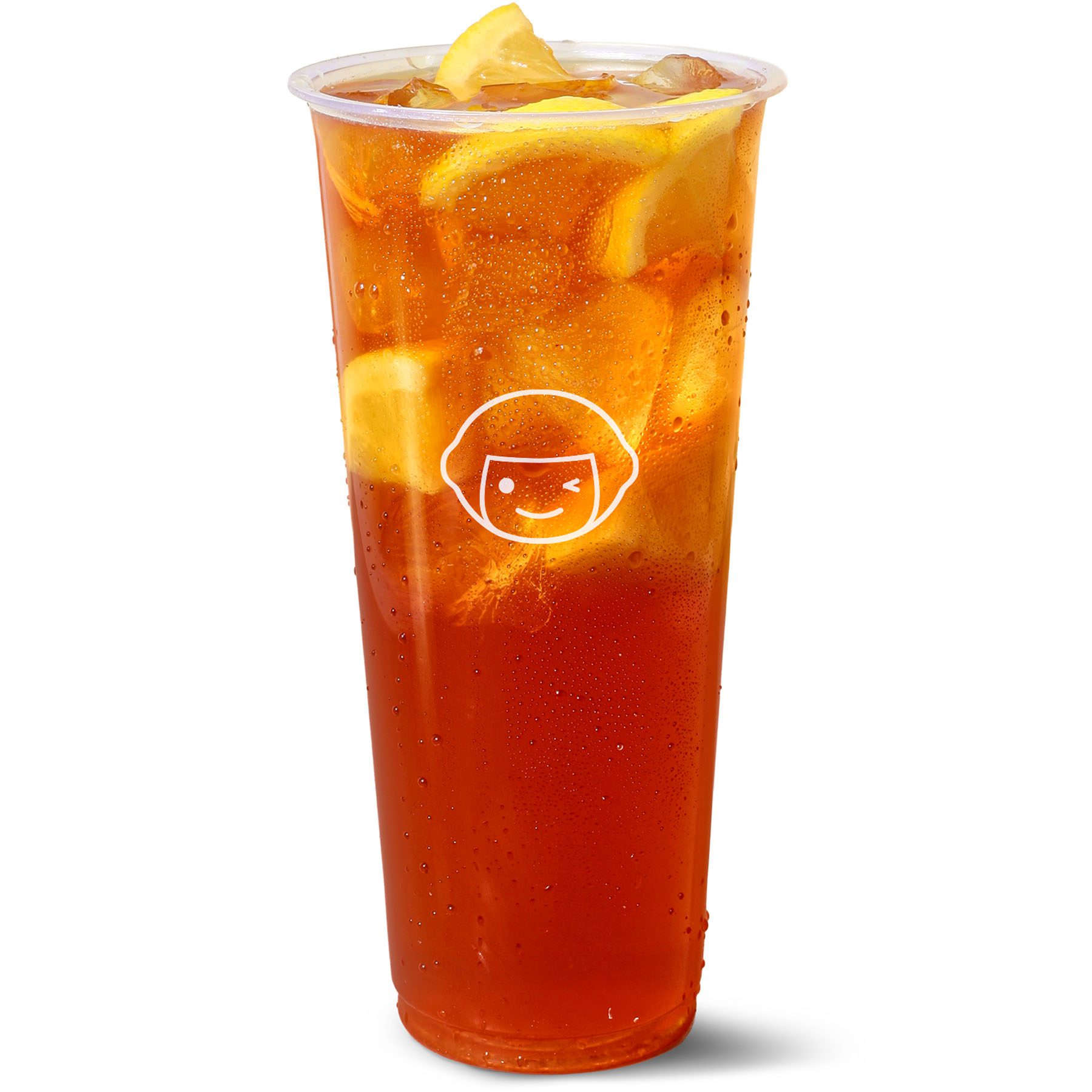 A clear plastic cup filled with iced tea and several lemon wedges, with condensation on the outside. The cup has a simple cartoon face logo printed in white on the front.
