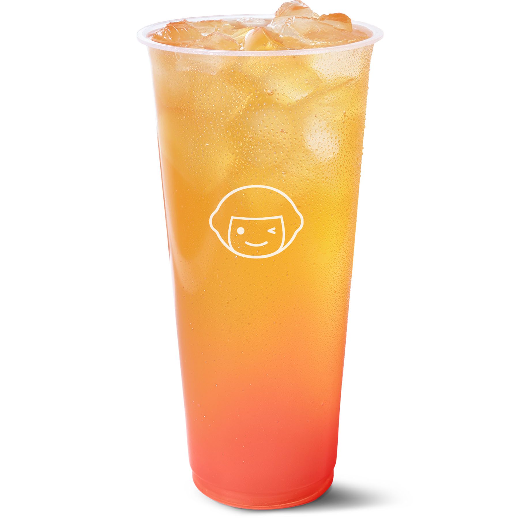 A tall, clear plastic cup filled with a gradient orange-to-red iced drink, topped with ice cubes. The cup features a simple, smiling face logo on the front.