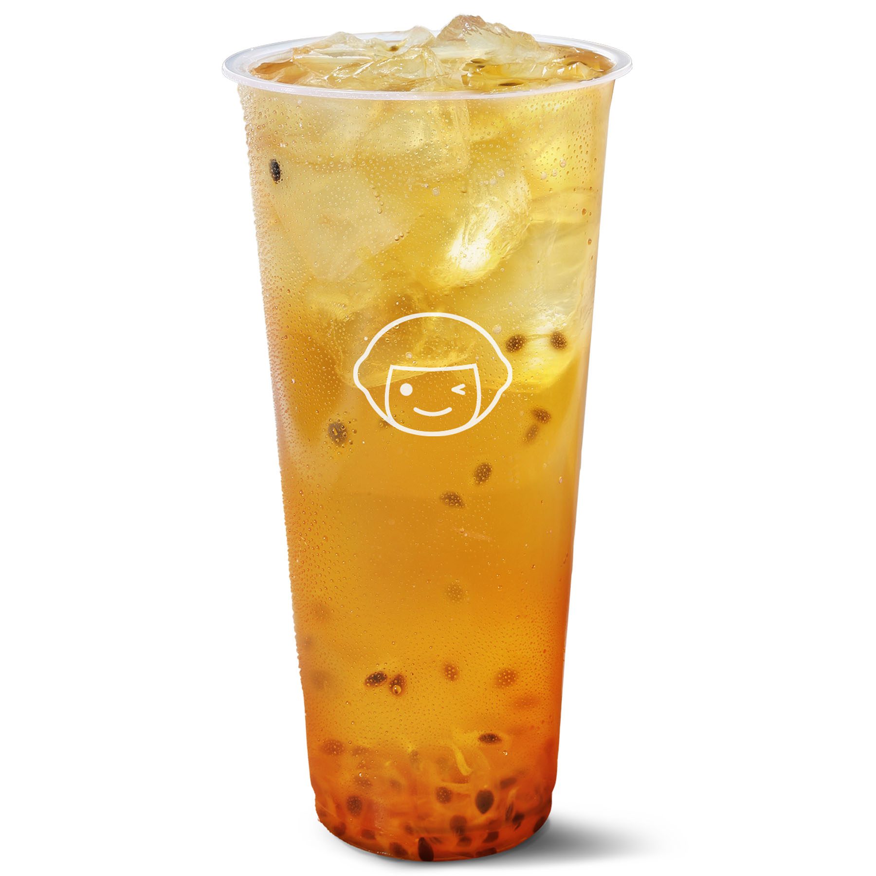 A clear plastic cup filled with iced passion fruit tea and orange boba pearls, with a white cartoon face logo printed on the cup.