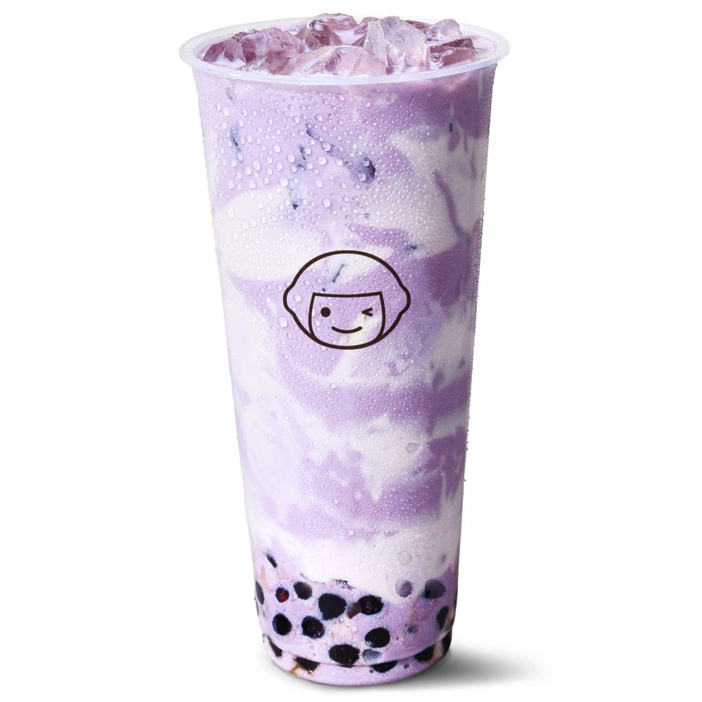 A clear plastic cup filled with a purple and white swirled iced drink, topped with ice and containing black tapioca pearls at the bottom. The cup features a simple cartoon face logo.