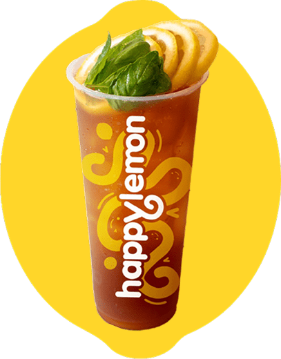 A clear plastic cup with the "happylemon" logo, filled with iced tea, garnished with lemon slices and green leaves, placed against a yellow background.